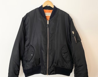 orange bomber jacket outfit