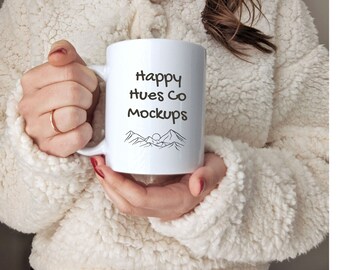 May include: White ceramic mug with a black outline of mountains and a sun. The text "Happy Hues Co Mockups" is printed on the mug.