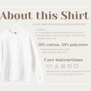 May include: White crewneck sweatshirt on a hanger. The shirt is made of a blend of 50% cotton and 50% polyester. Care instructions include machine washing cold, avoiding bleach, and tumble drying on low.