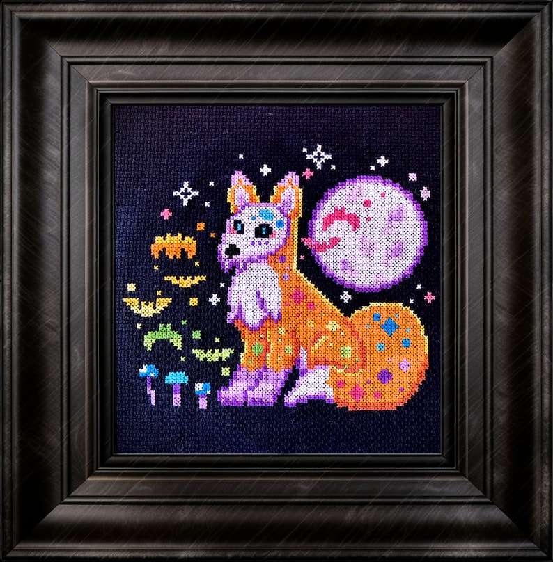May include: A cross-stitch embroidery of a colorful fox with a purple moon and bats in the background. The fox is wearing a sugar skull design.