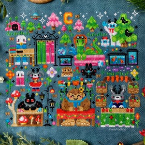 May include: A colorful cross-stitch pattern featuring a variety of woodland creatures, including a bear, a dragon, a bat, and a fox. The pattern also includes a variety of plants and flowers, as well as a small house and a sign that says "C".