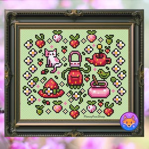 May include: Cross-stitch artwork in a dark green frame. The design features a light green background with pixelated images of strawberries, flowers, a cat, a hat, a watering can, and a jar. The text "FlossyFoxShop" is at the bottom.