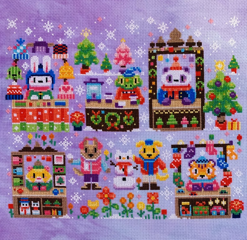May include: A cross-stitch pattern featuring a winter village scene with various animal characters, including a bunny, a fox, a bear, and a tiger. The scene is set against a purple background with snowflakes and a snowy landscape.