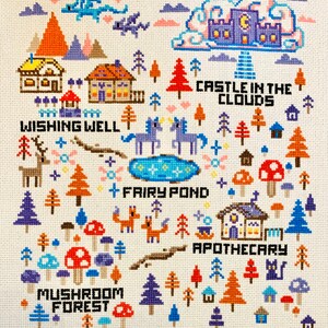 May include: Cross-stitch design featuring a whimsical fantasy landscape. Includes a castle in the clouds, fairy pond, mushroom forest, and apothecary. The design incorporates various trees, mushrooms, foxes, and a deer, all rendered in colorful cross-stitch.