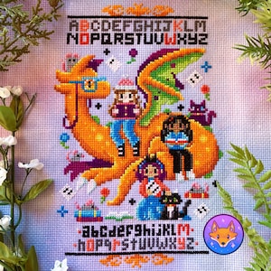 May include: Cross stitch pattern featuring a colorful orange dragon with a green wing, carrying four people. The dragon is surrounded by flowers, stars, and other whimsical details. The pattern includes the alphabet in both uppercase and lowercase letters.
