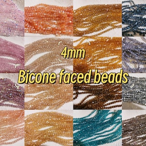 May include: Assortment of 4mm bicone faced beads in various colours, including pink, orange, brown, blue, and grey.