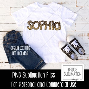 May include: A white t-shirt with the name "SOPHIA" printed in gold glitter letters with a leopard print pattern. The shirt is on a white wooden background with blue jeans and black sneakers.