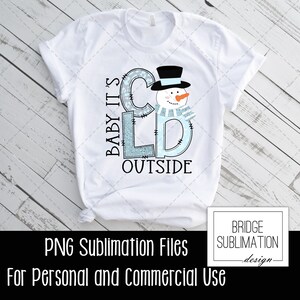 May include: A white t-shirt with a blue and white snowman design. The text "Baby It's Cold Outside" is written in a blue and white font. The design is perfect for sublimation.