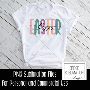 May include: A white t-shirt with a colorful graphic that says "Happy Easter" in a whimsical font.