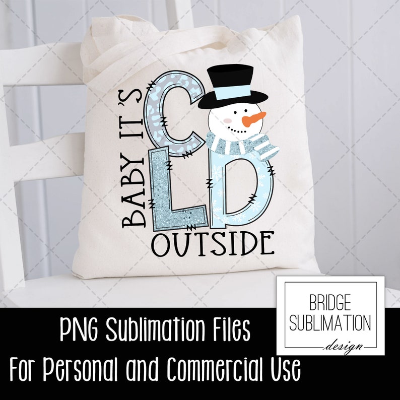 May include: A white tote bag with a blue and white snowman design. The text "Baby it's cold outside" is written in blue and white letters. The bag is for sublimation printing and is for personal and commercial use.