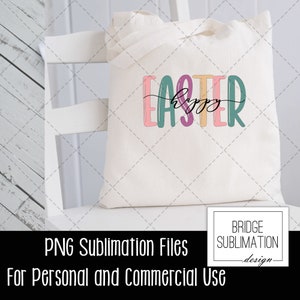 May include: A white tote bag with the text "Happy Easter" in colorful letters. The text is in a playful, handwritten font. The bag is a sublimation blank, suitable for personal or commercial use.