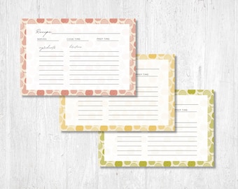 May include: Three printable recipe cards with a polka dot pattern. The cards are in shades of pink, yellow, and green. Each card has sections for "serves", "cook time", "prep time", "ingredients", and "directions".