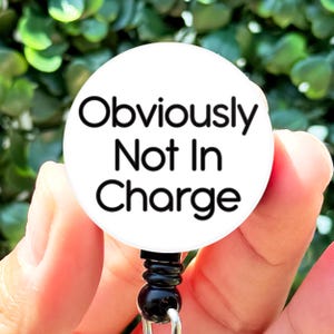 Nurse Badge Reel Funny Obviously Not In Charge Text Retractable Badge Reel with Swing Clip and 34 Inch Cord