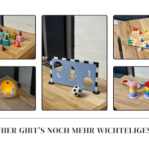 May include: A collection of wooden toys and games, including a soccer goal with a ball, a board game with dice, and stacking toys. The image also features a nativity scene and other colorful blocks.