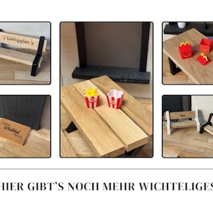 May include: A collection of miniature wooden furniture and accessories, including benches, a table, and fast-food-style containers. The benches have black and white accents, and the table is made of light-colored wood. The accessories include miniature fries and containers.