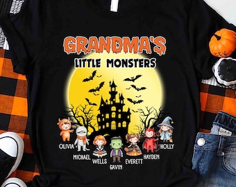 May include: A black t-shirt featuring the text "GRANDMA'S LITTLE MONSTERS" above a yellow moon, a black haunted house silhouette, and flying bats. Below are seven cartoon children in Halloween costumes with the names Olivia, Michael, Wells, Gavin, Everett, Hayden, and Holly printed underneath each character.