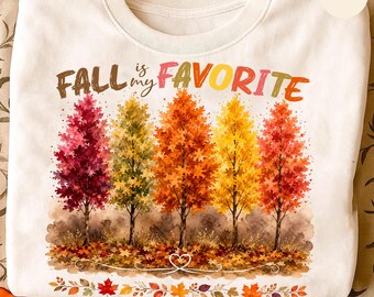 May include: A white crewneck sweatshirt featuring a colorful graphic of five autumn trees in shades of pink, yellow, orange, and red. The text "FALL is my FAVORITE" is printed above the trees, and a border of fallen leaves sits at the bottom.
