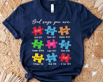 Camiseta "Dios dice que eres" para concienciar sobre el autismo, diseño de pieza de rompecabezas cristiano.