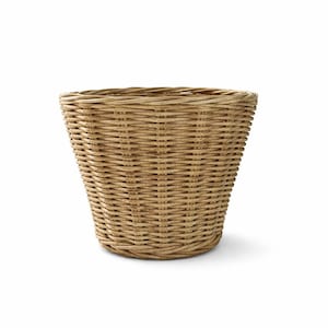 May include: A woven wicker basket with a flared shape. The basket is made of light brown wicker and has a textured surface. The basket is empty and sits on a white background.