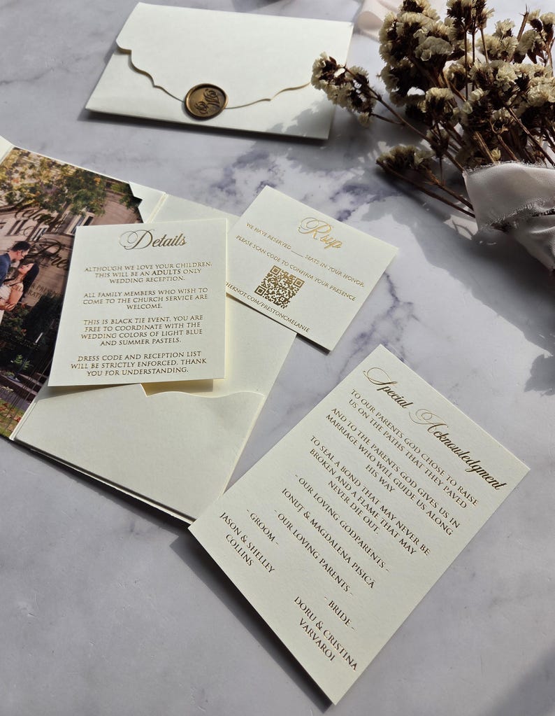 May include: A wedding invitation suite with a gold and white color scheme. The invitation features a special acknowledgment to the parents and godparents of the couple. The invitation includes the names of the bride and groom, "Doru & Cristina Varvaroi" and "Jason & Shelley Collins".