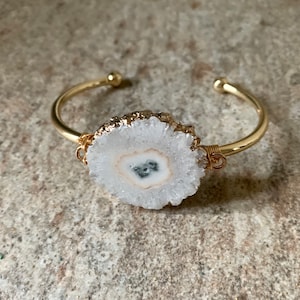 White Ice Solar Quartz Cuff. Gold.