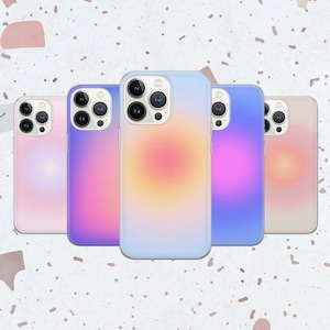 May include: Four iPhone cases with a gradient design. The cases are in shades of pink, blue, yellow, and beige.