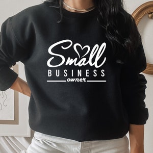 May include: Black sweatshirt with white text that reads "Small Business owner" with a heart symbol in the word "Small".