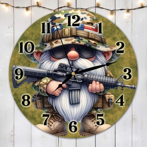 May include: A round clock with a camouflage pattern features a cartoon gnome wearing a camouflage hat and holding a rifle. The gnome has a white beard and sunglasses. The clock face has black numbers and hands.