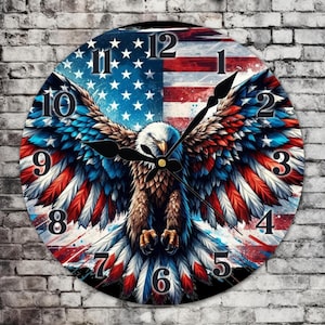 May include: Round wall clock featuring an American flag design split in half with a detailed eagle illustration. The eagle has outstretched wings with red, white, and blue feathers. Black clock hands and numerals complete the patriotic theme.