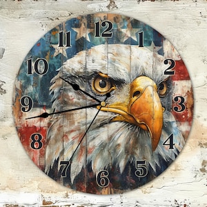 May include: A round wooden clock with a distressed wood effect. The clock face features a close-up of a bald eagle's head with a red, white, and blue American flag background. The numbers on the clock face are in black.
