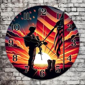 May include: A round clock with a silhouette of a soldier standing at attention in front of an American flag. The clock face has Roman numerals and a sunset background.