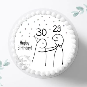 Könnte beinhalten: Ein runder, weißer Kuchen mit dekorativem Rand. Der Kuchen zeigt ein schwarz-weißes Cartoon-Design mit den Zahlen 30 und 29, Konfetti und den Worten "Happy Birthday!"