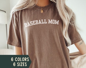 May include: A brown t-shirt with the text "BASEBALL MOM" in white lettering. The t-shirt is available in 6 colors and 6 sizes. The color shown is espresso.