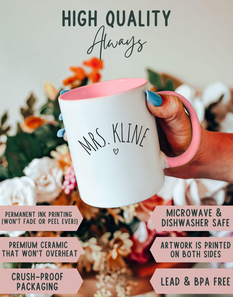 May include: White ceramic mug with a pink interior and handle, featuring the text "MRS. KLINE" in black script. The mug is held in a hand with blue nail polish, with the words "HIGH QUALITY Always" at the top.