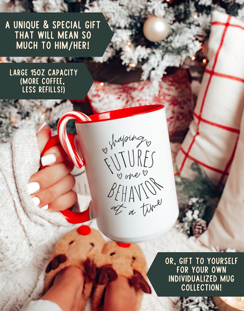 May include: White ceramic mug with a red interior and handle, featuring the text "shaping FUTURES one BEHAVIOR at a time." A candy cane rests on the rim. The mug has a 150z capacity. The image includes text that says "A unique & special gift" and "Gift to yourself."