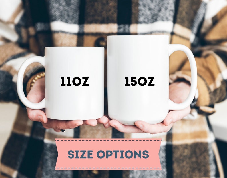 May include: Two white ceramic mugs with black text. The mug on the left says "11oz" and the mug on the right says "15oz".