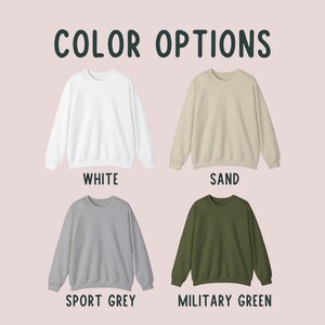May include: Four crewneck sweatshirts in different colours: white, sand, sport grey, and military green.  COLOR OPTIONS is written at the top of the image.
