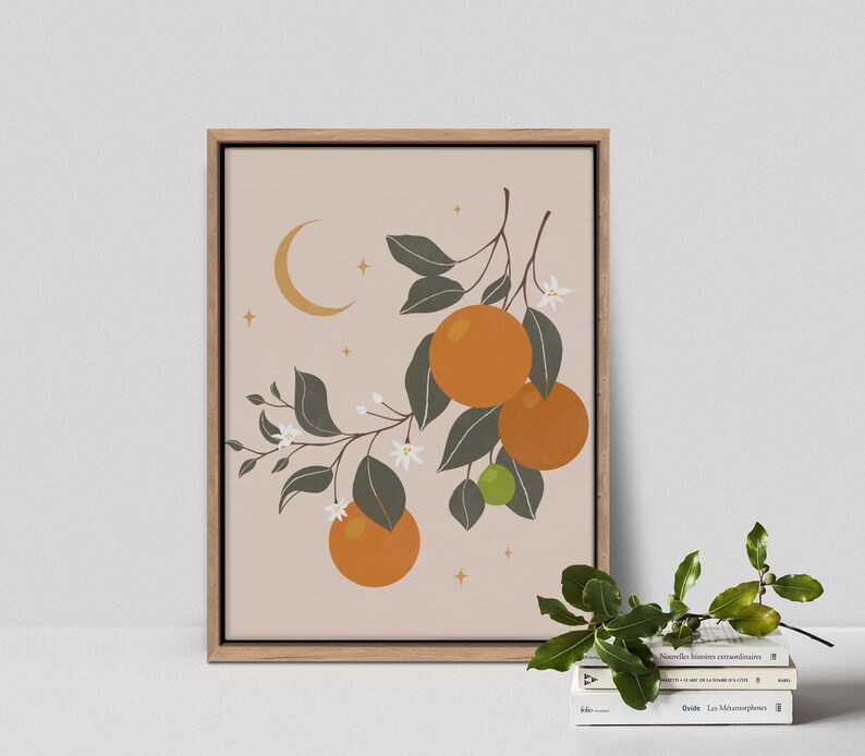May include: A framed print of a stylized illustration of an orange tree with green leaves, white blossoms, and orange fruit. The background is a light peach color with a crescent moon and stars.
