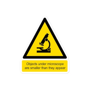 Objects under microscope are smaller than they appear - Parody warning sign sticker