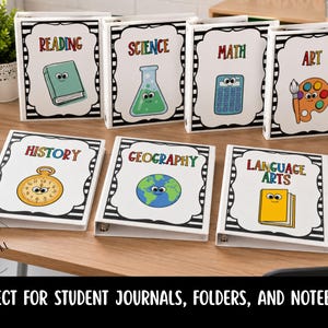 May include: A set of seven white three-ring binders featuring black and white striped borders and colorful cartoon illustrations with labels for Reading, Science, Math, Art, History, Geography, and Language Arts, each with a smiling face.