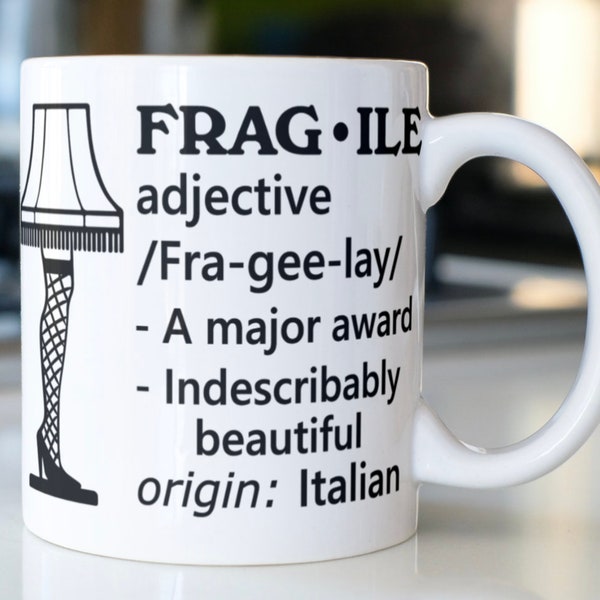 Funny Christmas Story saying coffee mug stating,"Frag*ile adjective /Fra-gee-lay/ -A major award -Indescribably beautiful origin:Italian"