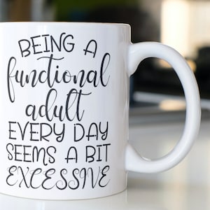 Funny Coffee mug stating “Being a functional adult every day seems a bit excessive”