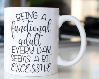 Funny Coffee mug stating “Being a functional adult every day seems a bit excessive”