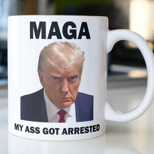 Funny Trump coffee mug stating,"MAGA My Ass Got Arrested"