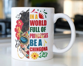 Sugar Skull coffee mug stating,"In A World Full Of Princesses Be a Chingona"