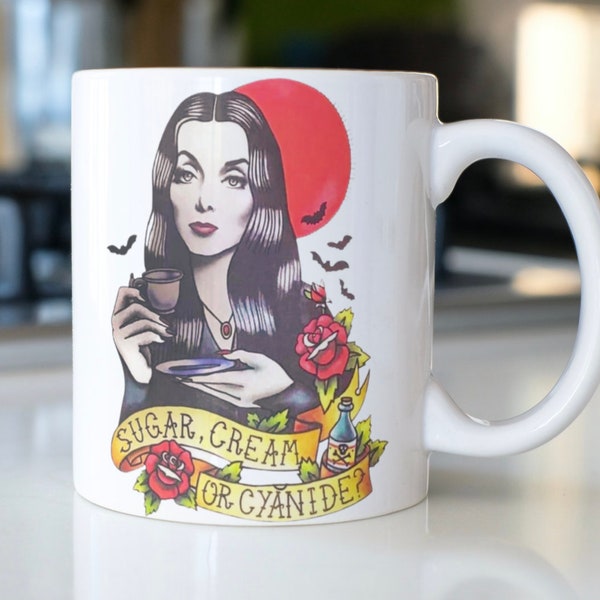 Funny Halloween Morticia Addams coffee mug stating,"Sugar, Cream Or Cyanide"