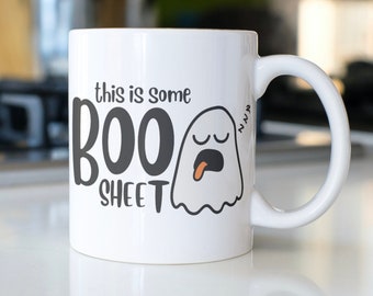 Funny Halloween Ghost coffee mug stating,"This is some BOO Sheet"