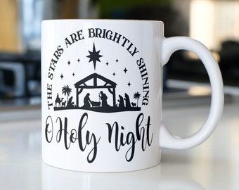 Nativity scene coffee mug stating,"O Holy Night The Stars Are Brightly Shining"