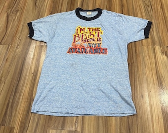 Large Vintage 70s 80s “I’m the Best There Is But I’m Not Available” Funny Novelty Iron On Blue 50/50 Ringer T Shirt Blue USA Made
