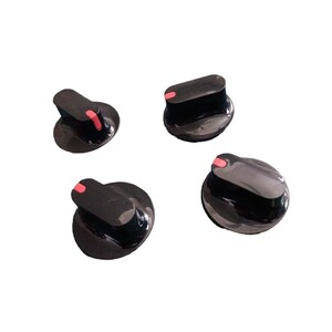 May include: Four black control knobs with a glossy finish, each featuring a small, rectangular pink indicator mark on the top edge. These circular components are designed for adjustment and have a smooth, rounded profile for manual operation.